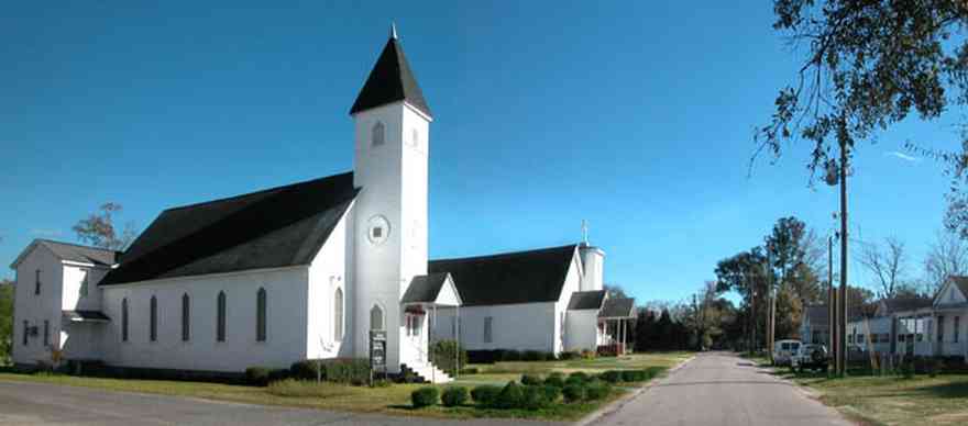 Century:-First-Baptist-Church_01.jpg:  church, steeple, cross, small town two-lane street, 