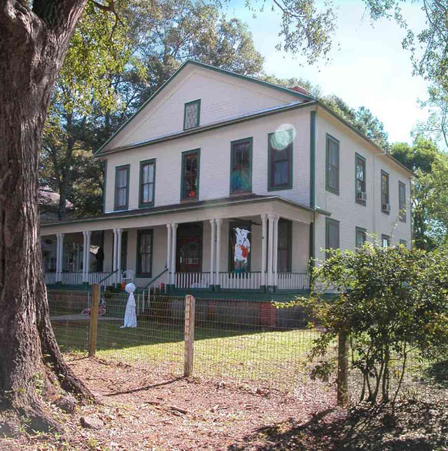 Century:-Historic-District:-7410-Jefferson-Avenue_01.jpg:  victorian house, front porch, pecan tree, oak tree, historic district