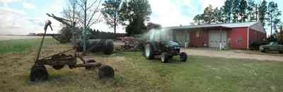 Davisville:-Beck-Sod-Farm_06.jpg:  catfish pond, fir tree, shed, windmill, sod, turf