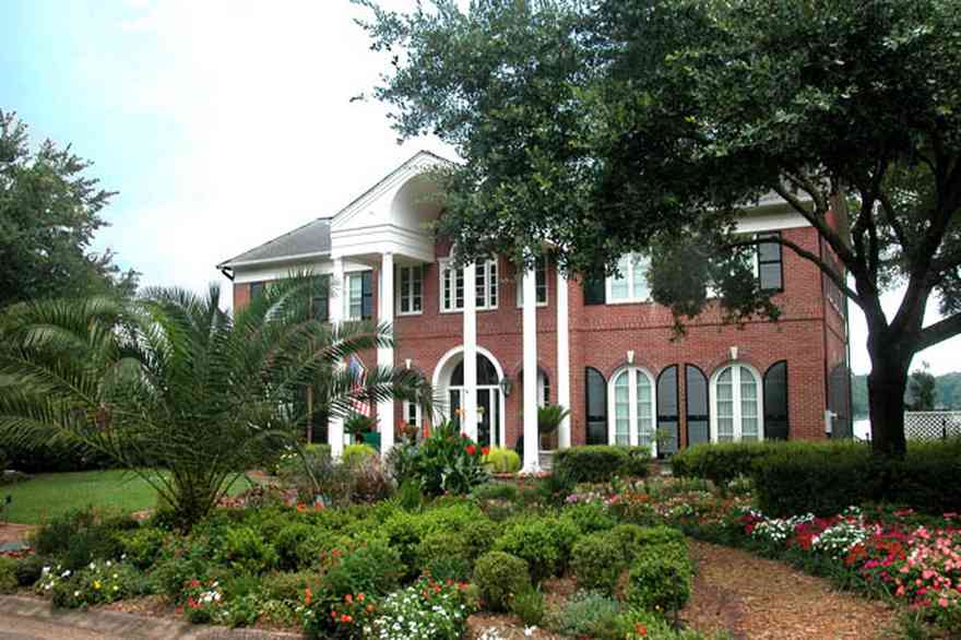 East-Hill:-2000-Whaley-Avenue_01.jpg:  red brick house, impatiens, box hedges, oak trees, columns, shutters, red brick, 