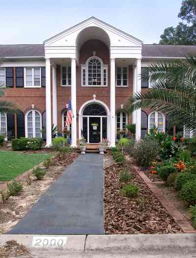 East-Hill:-2000-Whaley-Avenue_03.jpg:  red brick house, impatiens, box hedges, oak trees, columns, shutters, classical style, 