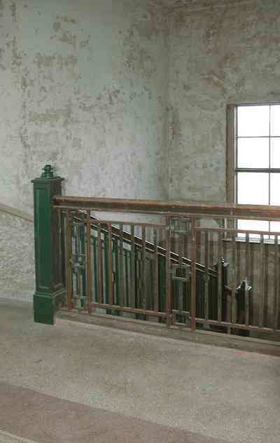 East-Hill:-Tower-East:-Old-Sacred-Heart-Hospital_49.jpg:  metal balustrade, staircase, granite floors, plaster walls