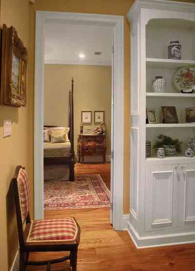 East-Pensacola-Heights:-112-Chipley-Avenue_07.jpg:  four poster bed, oriental rug, cupboard, library, heart-pine floors