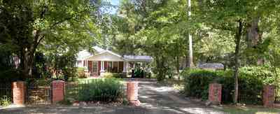 Jay:-Market-Road-Farm_01.jpg:  brick columns, brick fence, wrought-iron fence, farm house, farmland, pecan tree, santa rosa county