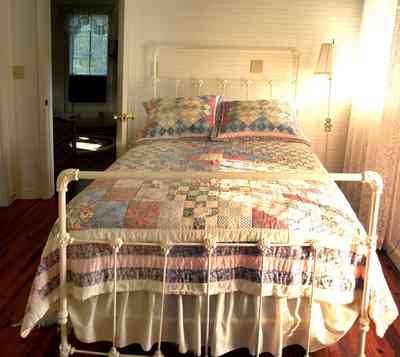 Milton:-Adventures-Unlimited_27.jpg:  home, house, cabin, victorian house, iron bed, quilt