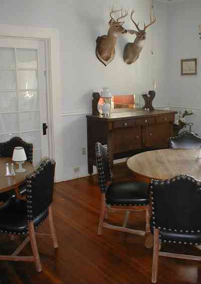 Milton:-Faircloth-Carroll-House-Restaurant_05.jpg:  picket fence, craftsman cottage, restaurant, shutters, leather chairs, trophy heads, mounted heads, french doors, milton, front porch