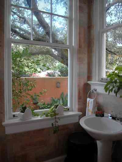 North-Hill:-123-West-Lloyd-Street_21.jpg:  bathroom, garden view, pedestal sink, oak tree, italienate style, spanish colonial revival