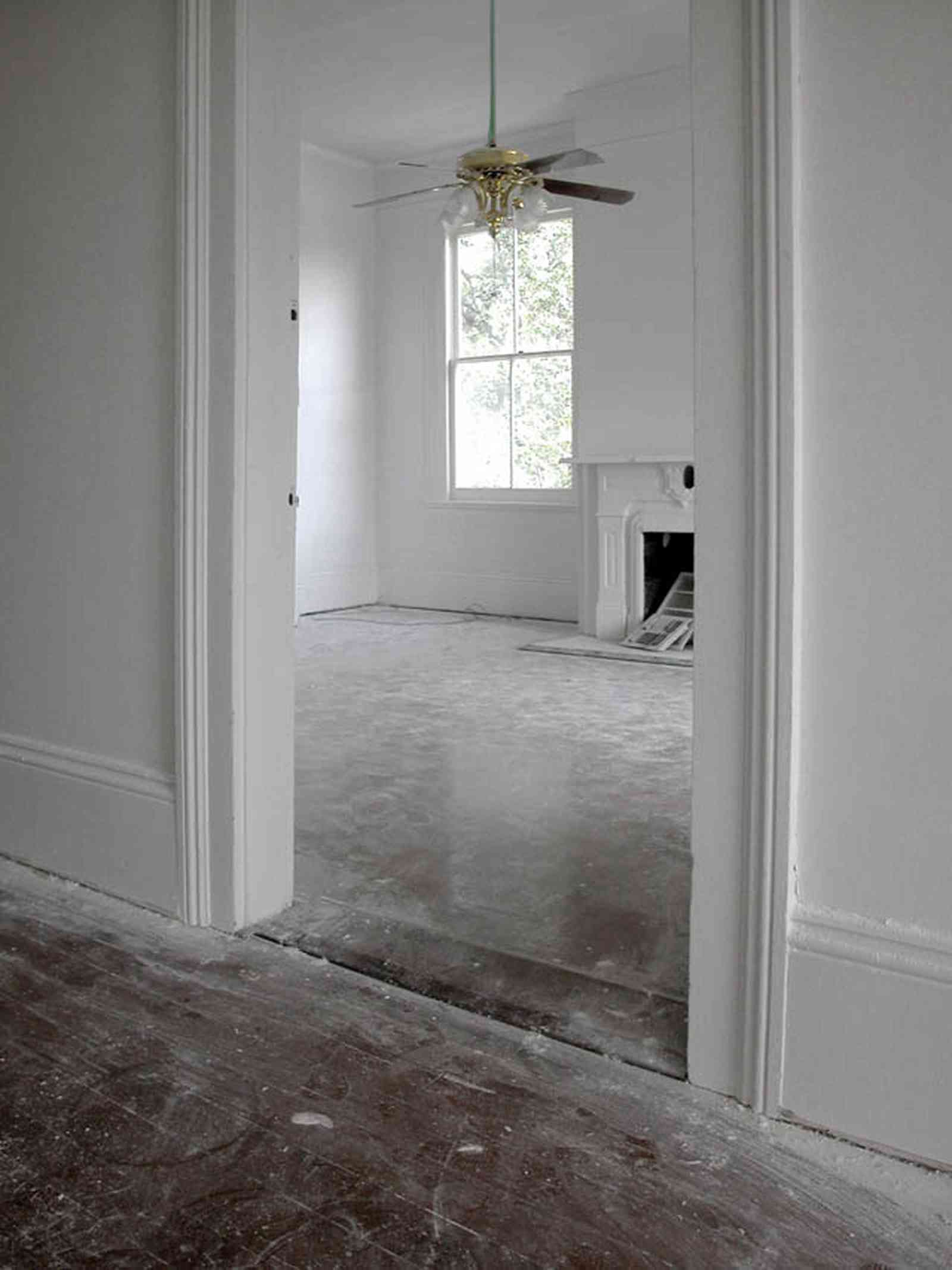 North-Hill:-200-West-Jackson-Street_28.jpg:  heart pine floor, ceiling fan, mantle piece, fireplace, front parlor