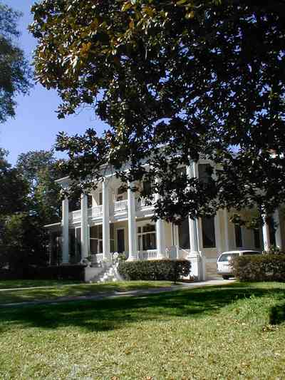 North-Hill:-204-Brainard-Street_02.jpg:  magnolia tree, ionic capitals, white house, white pillars, columns, veranda, porch, north hill preservation district