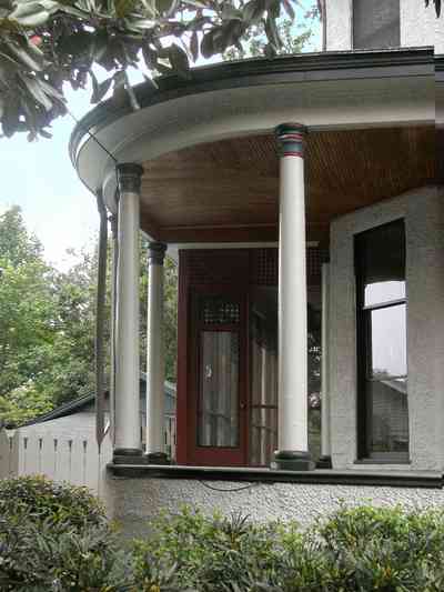 North-Hill:-304-West-Gadsden-Street_03.jpg:  columns, veranda, stucco walls, picket fence, magnolia tree, north hill preservation district