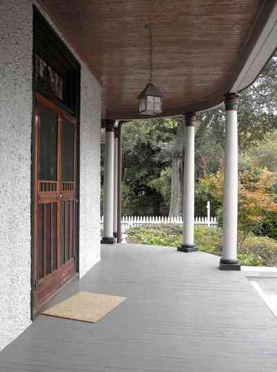 North-Hill:-304-West-Gadsden-Street_05.jpg:  columns, stucco walls, picket fence, magnolia tree, north hill preservation district, front door, screen door, stained glass transom