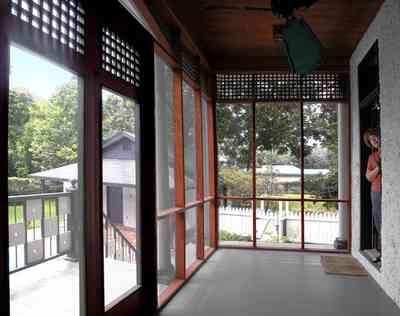 North-Hill:-304-West-Gadsden-Street_21.jpg:  screen porch, ceiling fan, pool house, magnolia tree, lattice work