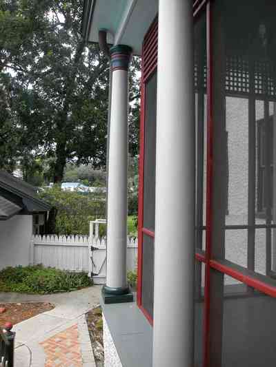 North-Hill:-304-West-Gadsden-Street_23.jpg:  columns, ionic column, picket fence, brick sidewalk, screened porch, lattice work, magnolia tree