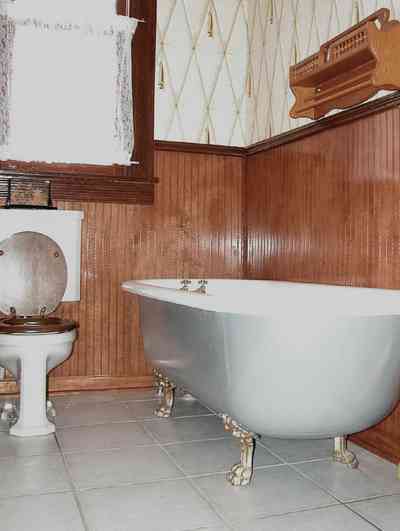 North-Hill:-52-West-Gonzalez-Street_20.jpg:  bathroom, claw foot tub, beaded wallboard, victorian house
