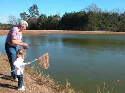 Oak-Grove:-Carpenters-Catfish-Farm_01a.jpg:  netting, fishing, catfish pond, dave daughtry, grace
