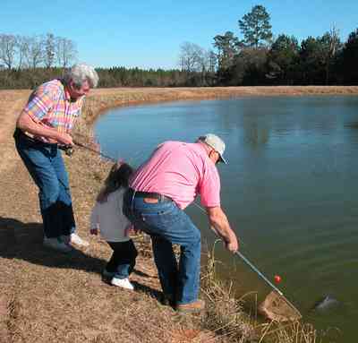 Oak-Grove:-Carpenters-Catfish-Farm_01aa.jpg:  catfish pond, hook, fisherman, deep water well