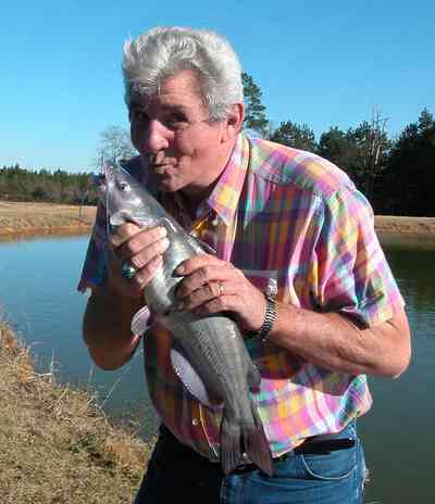 Oak-Grove:-Carpenters-Catfish-Farm_01bb.jpg:  catfish pond, fisherman, catfish, smooch, kiss, 