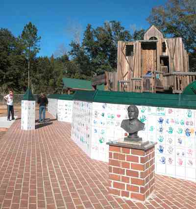 Pace:-Benny-Russell-Park_01-copy.jpg:  playground equipment, bust, statue, climbing, commemorative wall