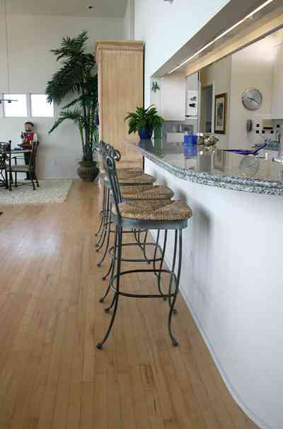 Pensacola-Beach:-Ariola-Drive-Art-Deco-House_28.jpg:  kitchen stools, kitchen counter, wood floors granite countertops, beach house, surf, beach front