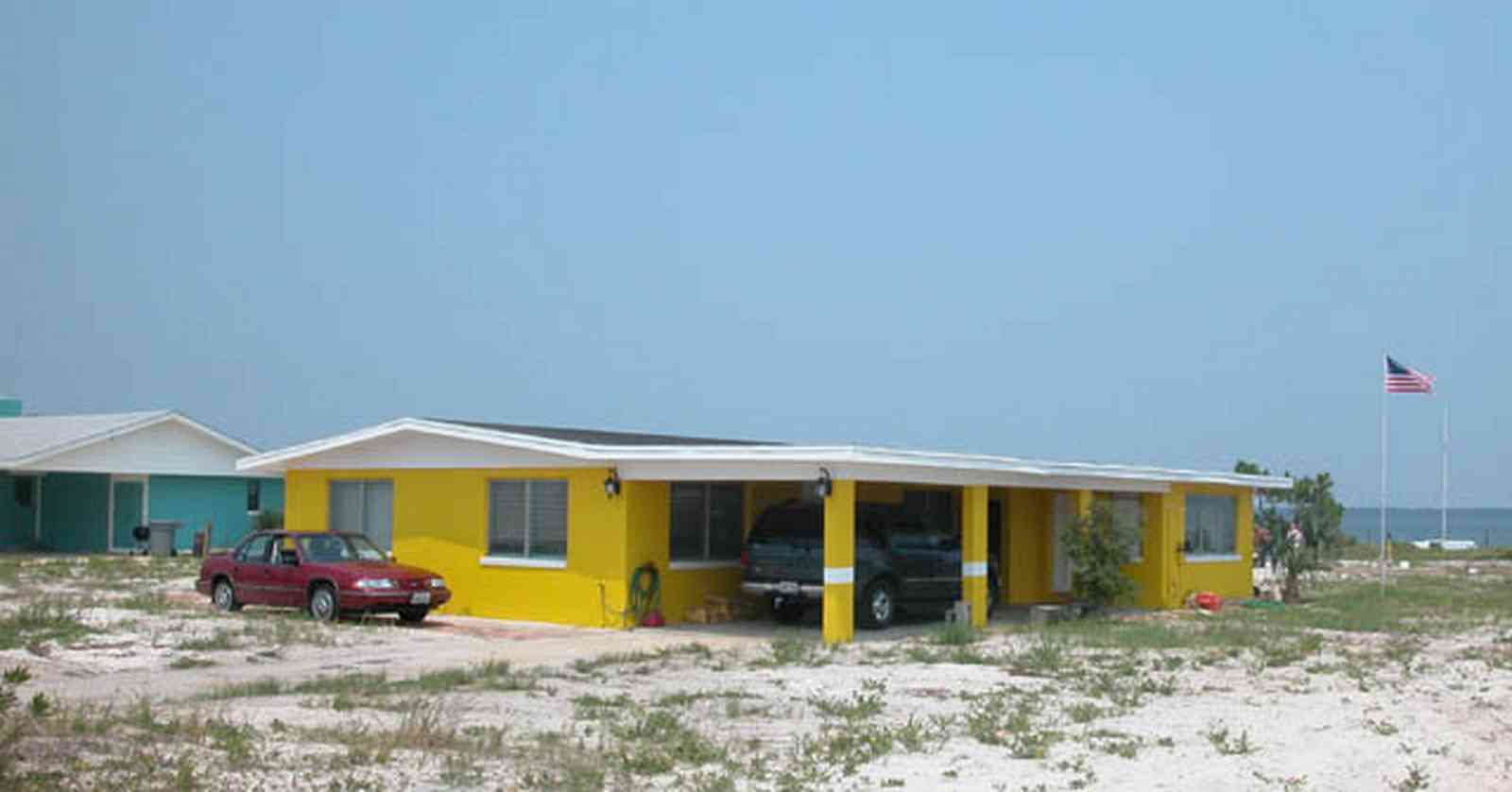 Pensacola-Beach:-Rio-Vista-Drive_06.jpg:  cement block house, yellow house, 1950's architecture, beach front house, pensacola bay