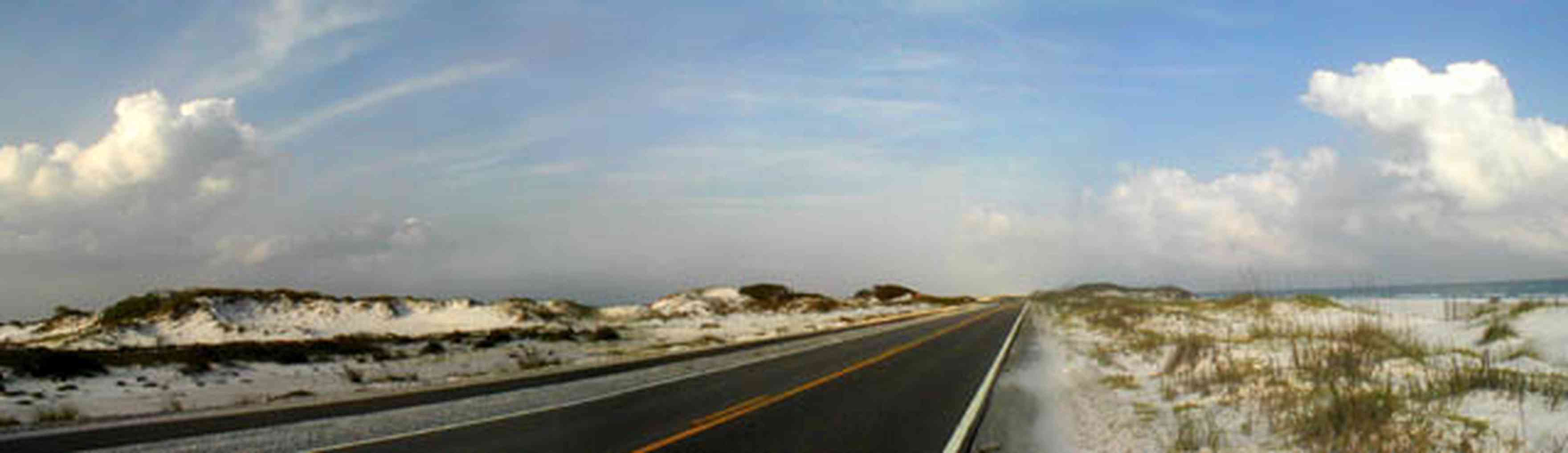 Pensacola-Beach:-Road_01.jpg:  santa rosa island, escambia county, pensacola beach, white sand, dunes, cumulus clouds, surf, emerald coast