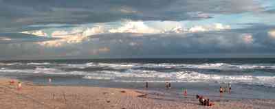Pensacola-Beach:-Sunset_03.jpg:  surf, waves, gulf of mexico, sand, swimmers, surfers, bathers, sunset, tropical storm