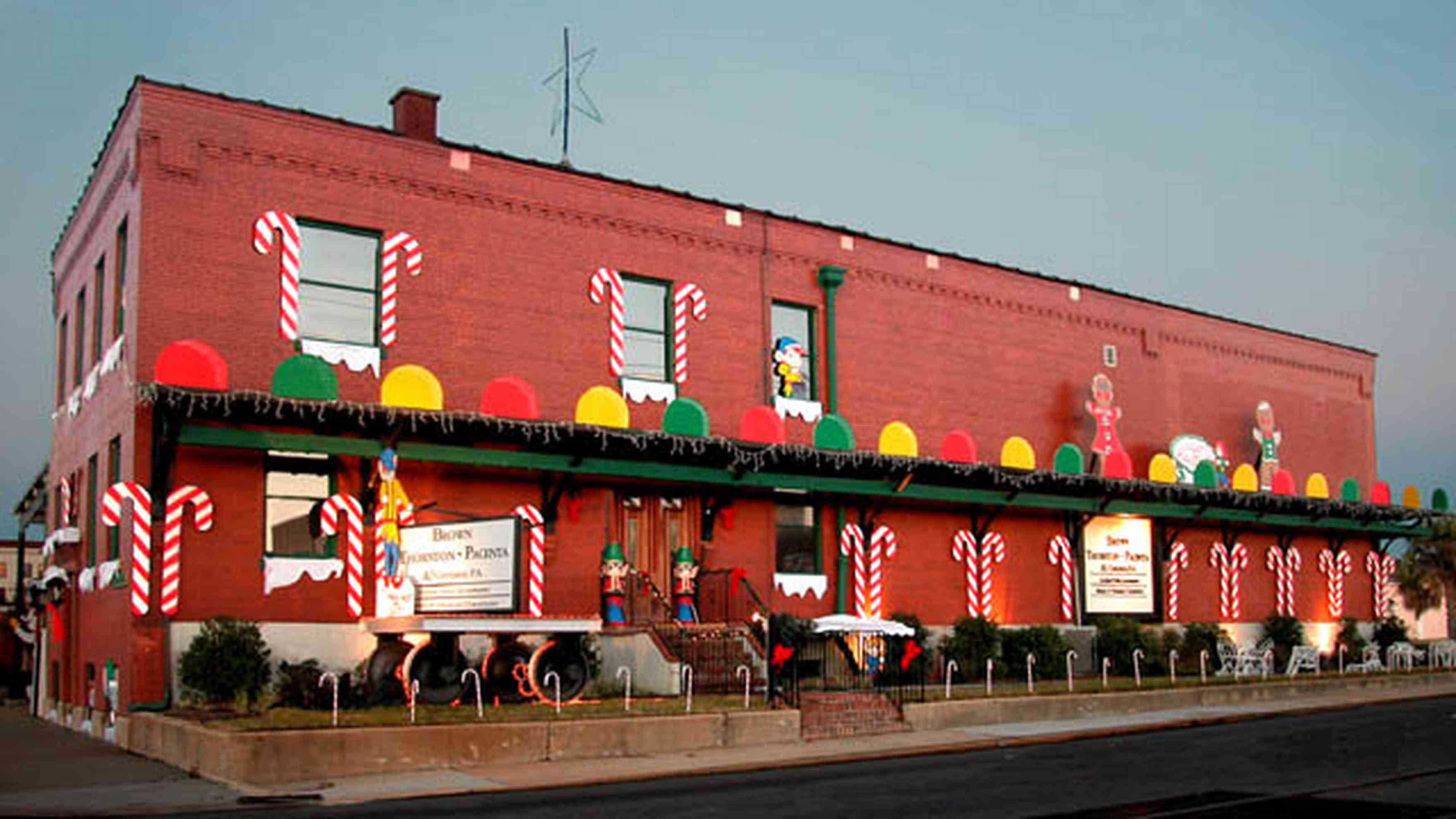 Pensacola:-Downtown:-Brown,-Thornton,-Pacenta-And-Company-P.A._01.jpg:  candy canes, gum drops, elves, twinkling lights, brick building, amour meat packing plant, downtown, christmas decorations