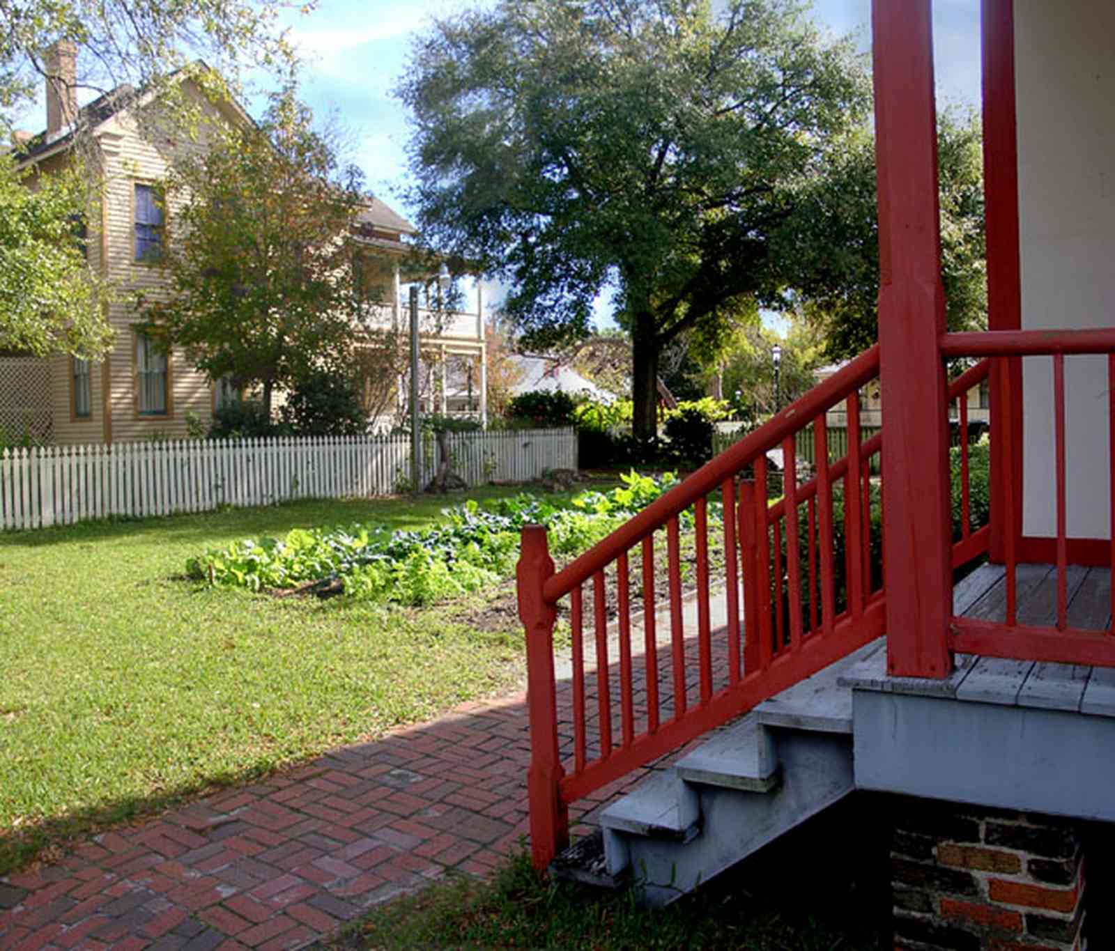 Pensacola:-Historic-Pensacola-Village:-LaValle-House_03.jpg:  kitchen garden, greens, turnips, lettuce, porch, picket fence