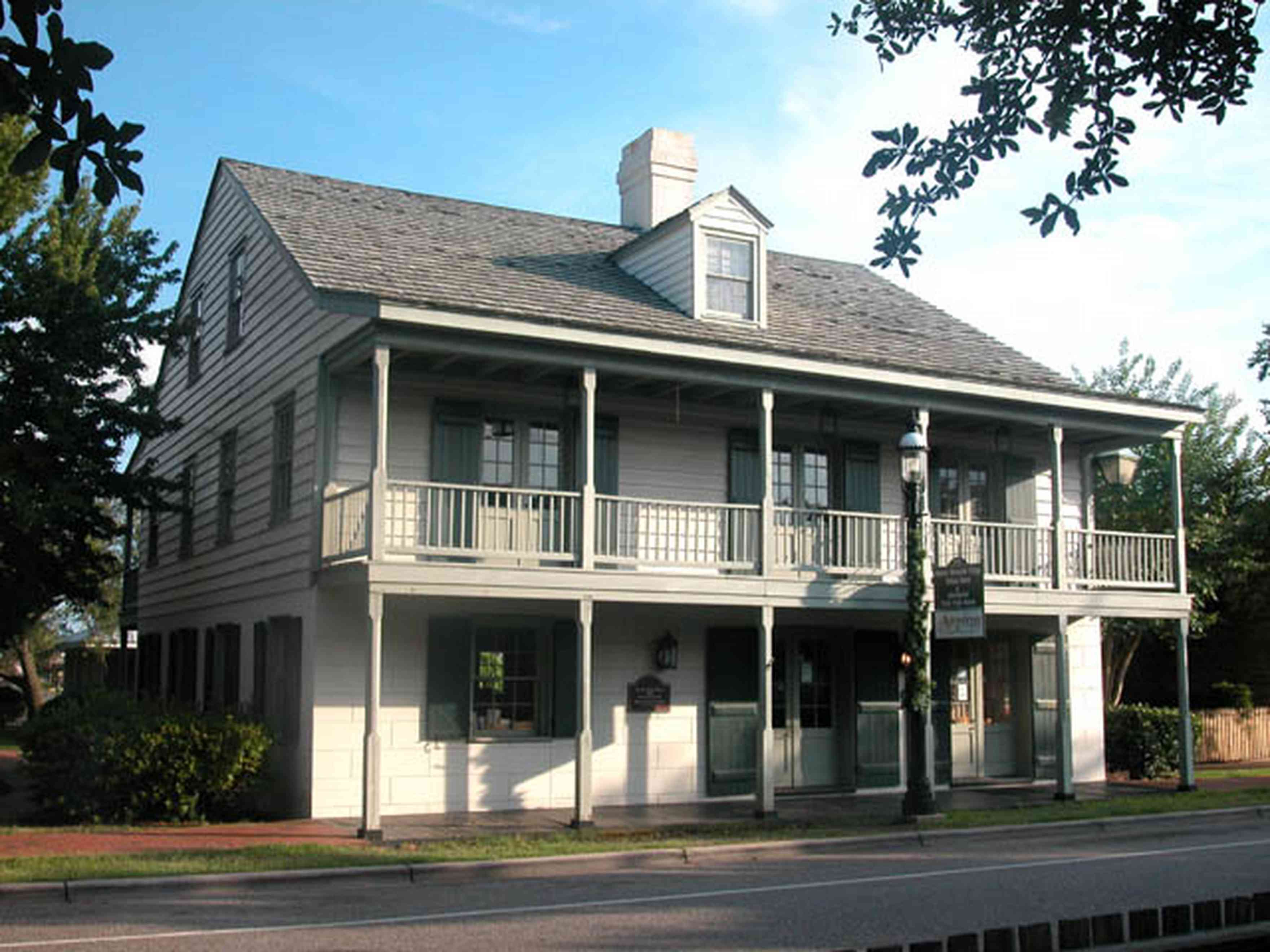 Pensacola:-Historic-Pensacola-Village:-Tivioli-House_00.jpg:  victorian home, porch, oak trees, museum, museum shop