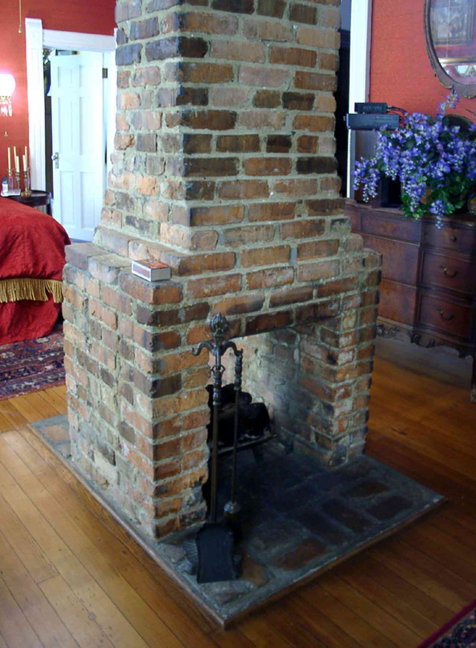 Pensacola:-Seville-Historic-District:-433-East-Zaragoza-Street_45a.jpg:  victorian house, fireplace, bedroom, wooden floors