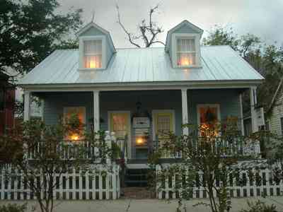 Pensacola:-Seville-Historic-District:-Estate-Jewelry_03.jpg:  picket fence, candles, wreath, victorian gulf coast cottage