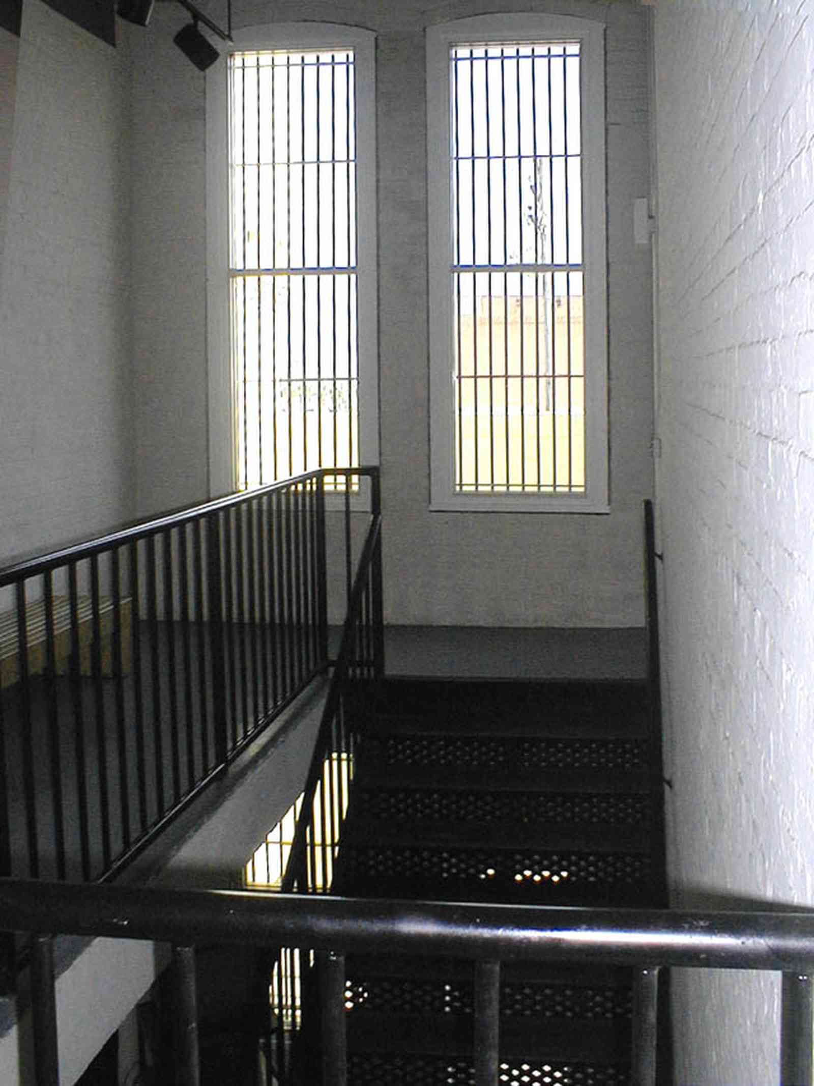 Pensacola:-Seville-Historic-District:-Old-City-Jail_11.jpg:  prisoner, jail, behind bars, barred windows, police department, city court, spanish revival building, pensacola museum of art