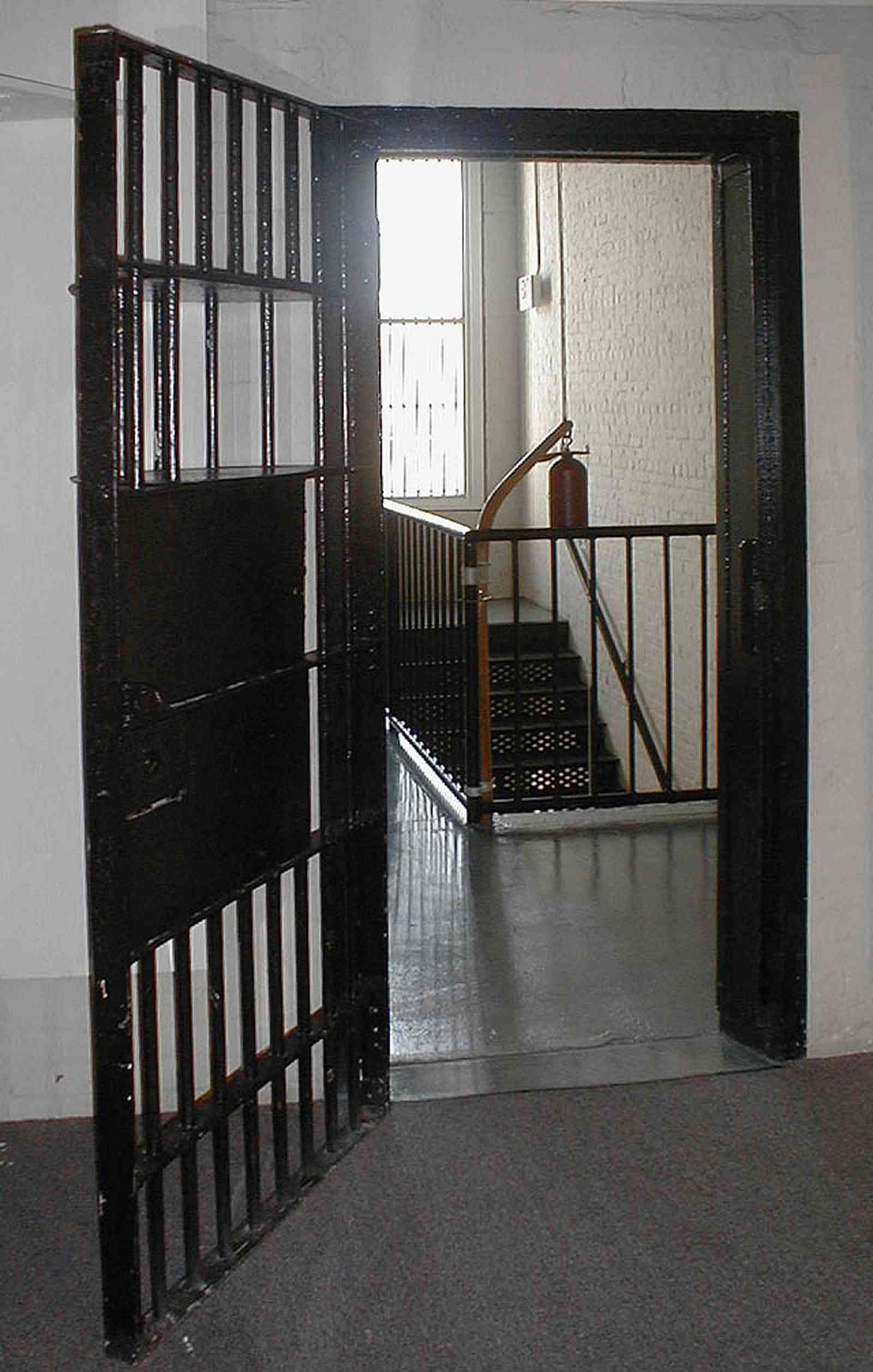 Pensacola:-Seville-Historic-District:-Old-City-Jail_12.jpg:  prisoner, jail, behind bars, barred windows, police department, city court, spanish revival building, pensacola museum of art