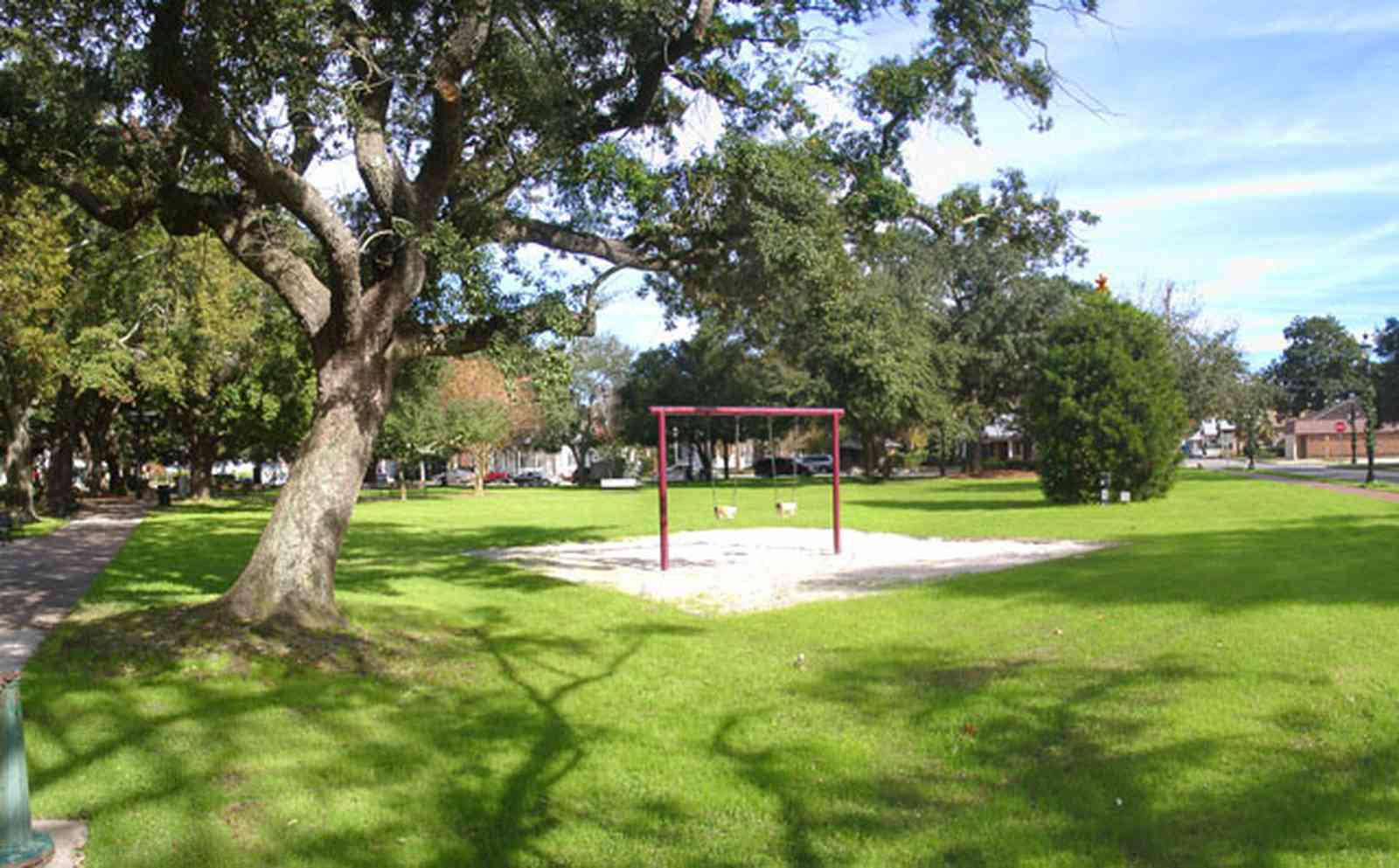 Pensacola:-Seville-Historic-District:-Seville-Square_01a.jpg:  childrens swing, cedar tree, oak tree