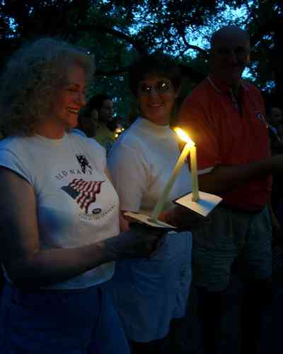 Pensacola:-Seville-Historic-District:-Seville-Square_14.jpg:  patriotic demonstration, american flag, candle light ceremony