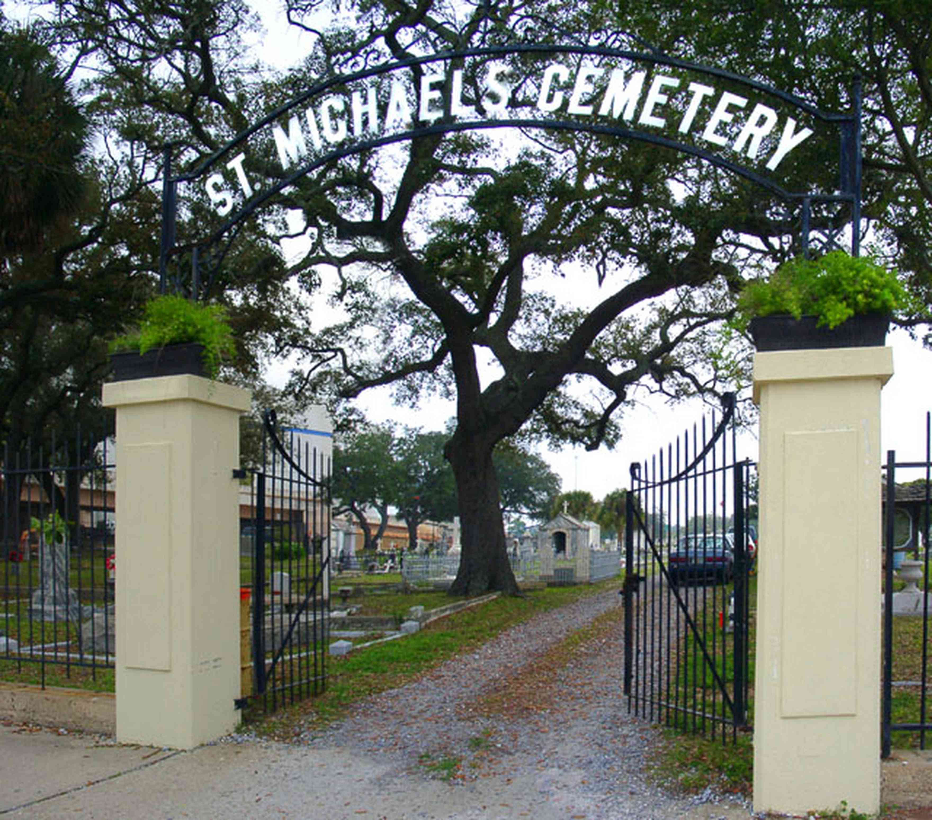Pensacola:-Seville-Historic-District:-St-Michael-Cemetery_01.jpg:  cemetery, gate, wrought iron gate, oak tree, ferns