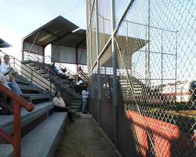 Pensacola:-Tate-High-School_02.jpg:  stadium, ball field, patrons, audience, mesh fence, shelter, gonzales, escambia county