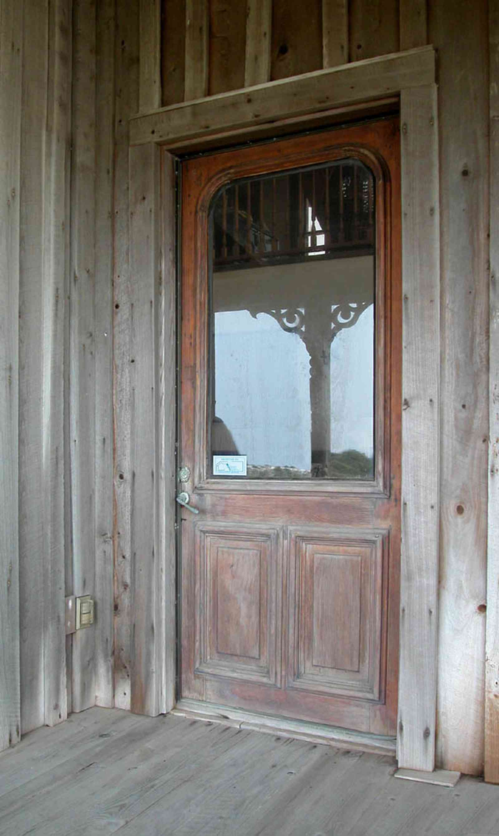 Perdido-Key:-Gothic-House_08i.jpg:  front door, juniper siding, porch, screen porch, summer house, gazebo, cedar shake roof, walkway, pier, deck, gulf of mexico, emerald water, dunes, sea oats, beach