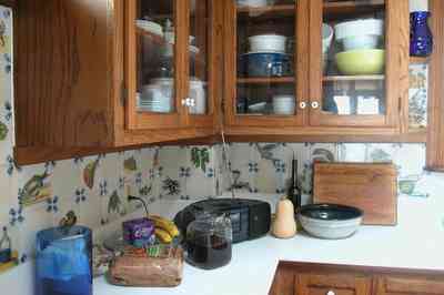 Perdido-Key:-Gothic-House_08l.jpg:  kitchen, ceramic tile, heartpine cabinet, knicknacks