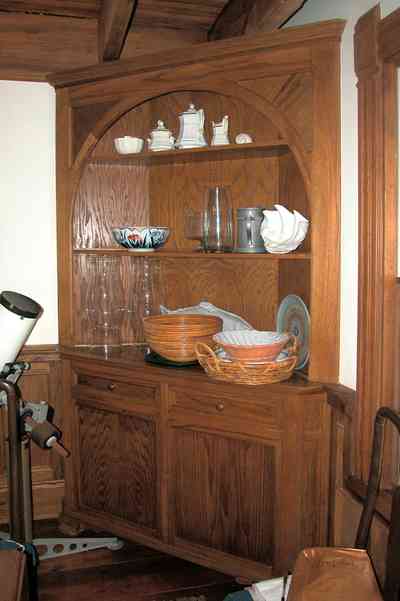 Perdido-Key:-Gothic-House_08o.jpg:  corner cabinet, heartpine lumber, knicknacks, telescope, ceiling beams