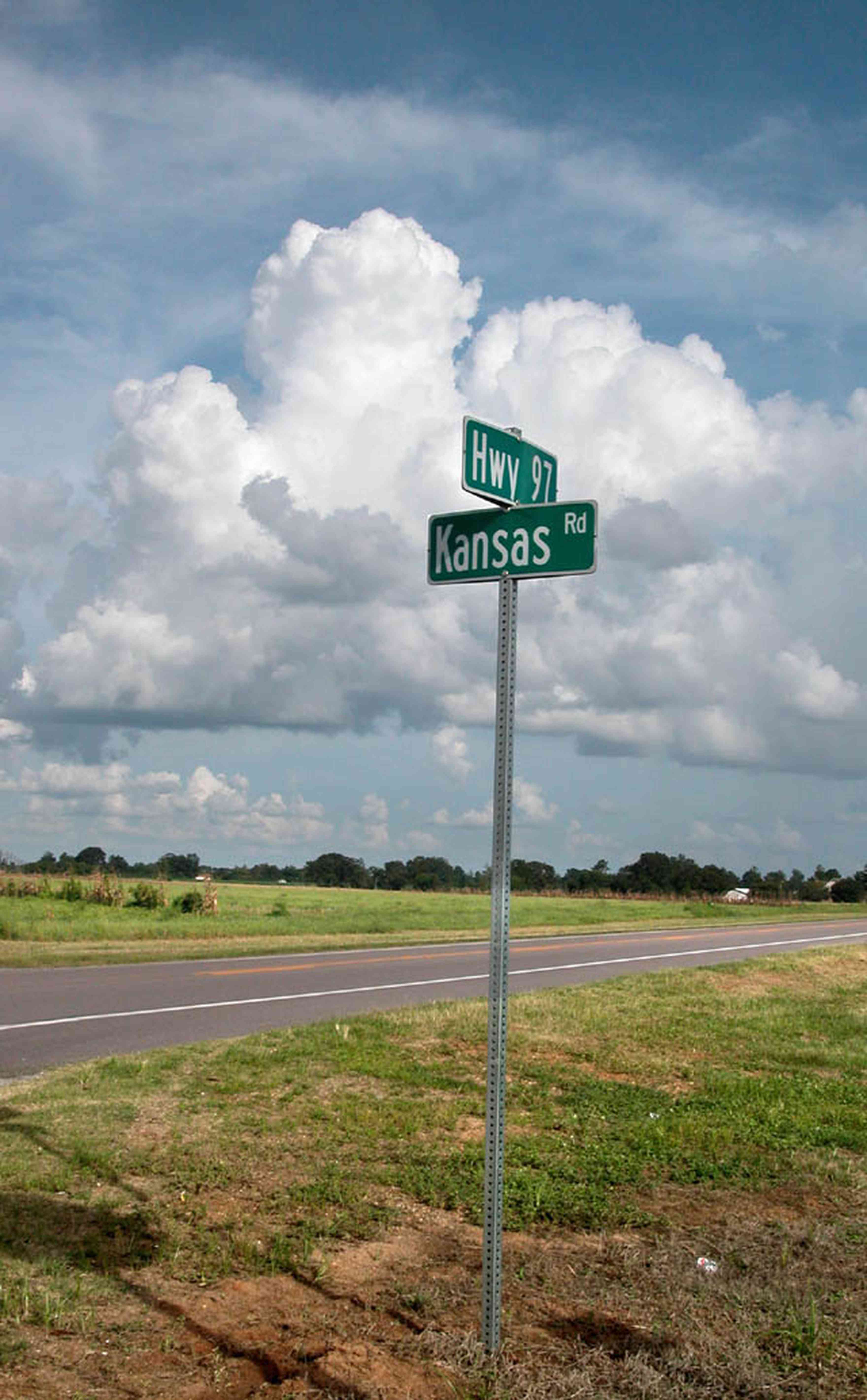 Walnut-Hill:-Kansas-Road:-Sign_00.jpg:  road sign, highway, two-lane road, country road, cumulus clouds, farm, farmland