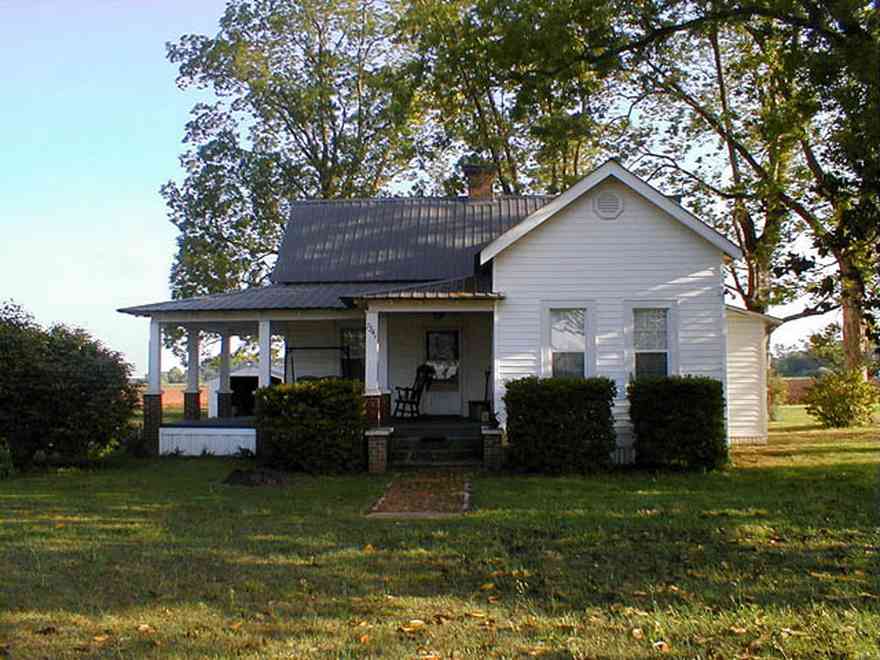 Walnut-Hill:-Ward-Farm_04.jpg:  farmland, craftsman style home, oak tree, magnolia tree, highway 97, corn field, menonite religious community, two-lane road, curving road, escambia county