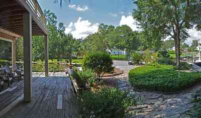 409+Montrose+Blvd-front+yard_02.jpg:  deck, porch, flagstone, lake, sail boat, 