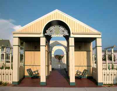 Aragon:-Childrens-Playground_02.jpg:  porch swing, columns, playground, picket fence, arbor, arch