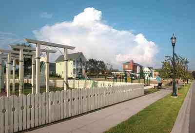 Aragon:-Childrens-Playground_04.jpg:  arch, columns, playground, picket fence, gateway, gate, trellis, lantern, porch swing