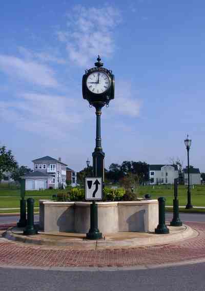 Aragon_3A_-Clock_02+copy.jpg:  aragon development, romana street, round-about, clock, brickwalk, traffic circle, victorian village