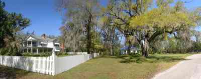Bagdad:-Creary-Crawford-Walsh-House_03.jpg:  picket fence, victorian house, oak tree, magnolia tree