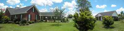 Cantonment:-Milestone:-Red-Brick-Mansion-B_04.jpg:  white board fence, pine tree, dorner window, columns, oak tree, crepe myrtle tree, guest house, subdivision, development, country road