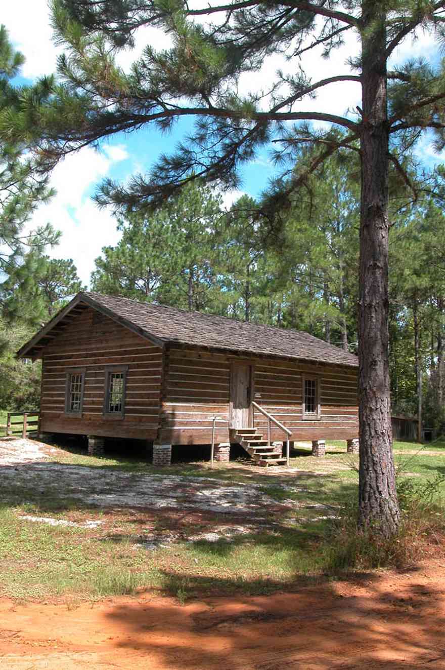 Cantonment:-Roy-Hyatt-Environmental-Center-Schoolhouse_01.jpg:  school, one-room schoolhouse, log cabin, pine trees, shake roof, wooden roof, cabin in the woods, single-pen house