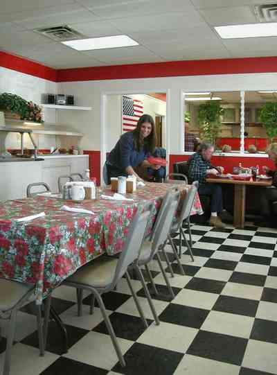 Century:-Panhandle-Restaurant_03.jpg:  restaurant, table, waitress, serving, buffet table, salad bar